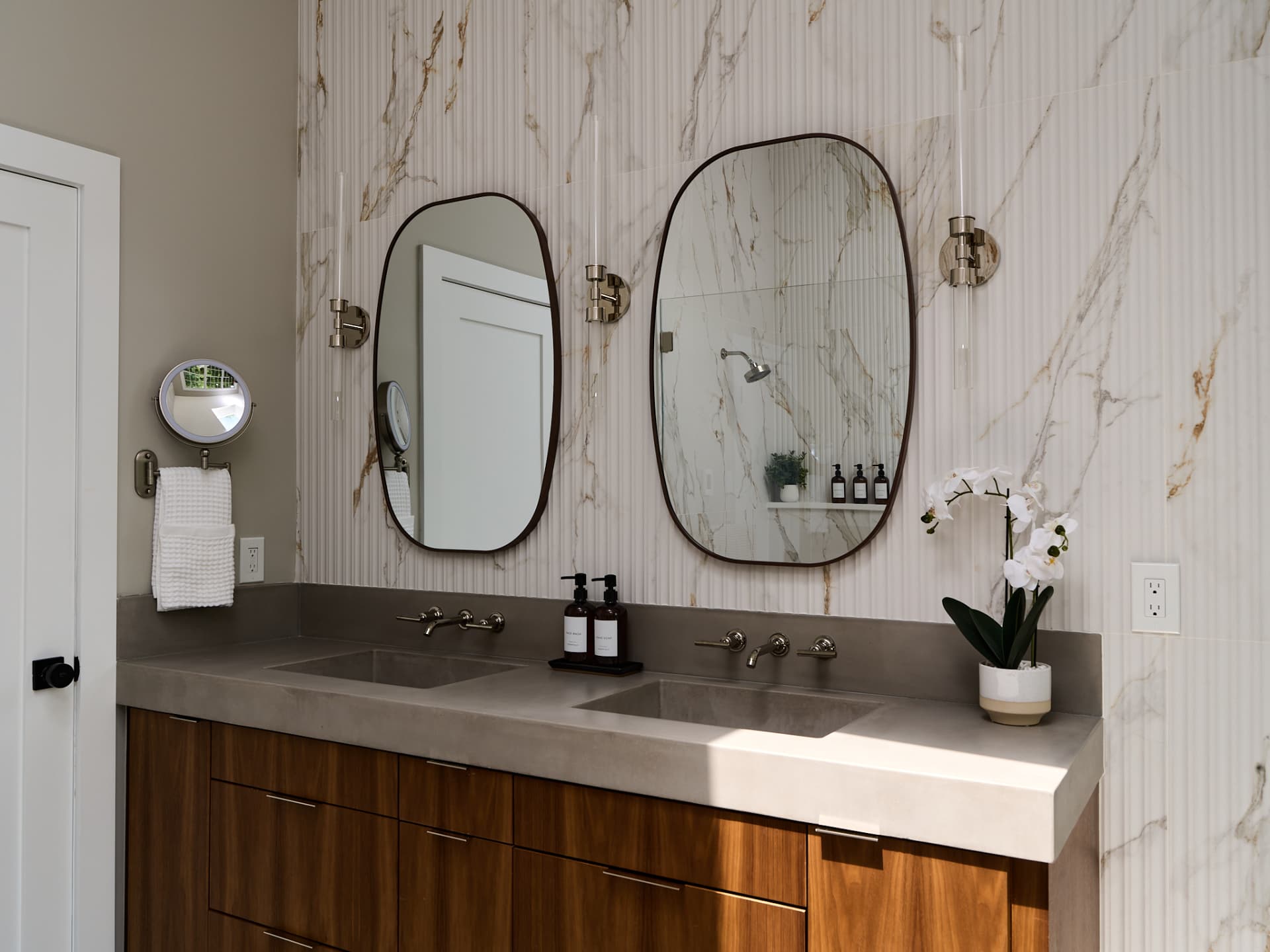 Walnut double vanity with a concrete trough top installed in a Doylestown PA primary bathroom remodel